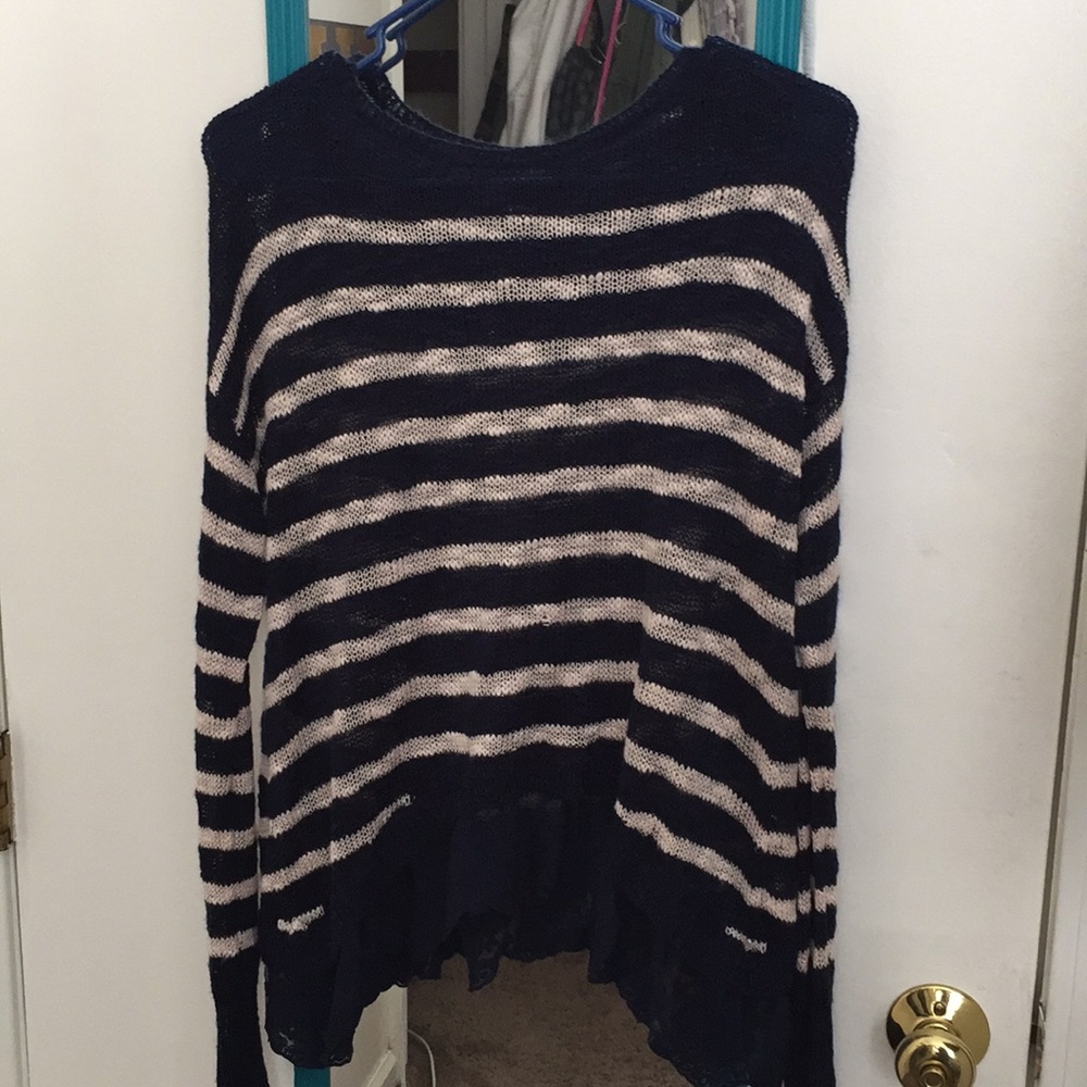 A blue and white striped blouse with lace.